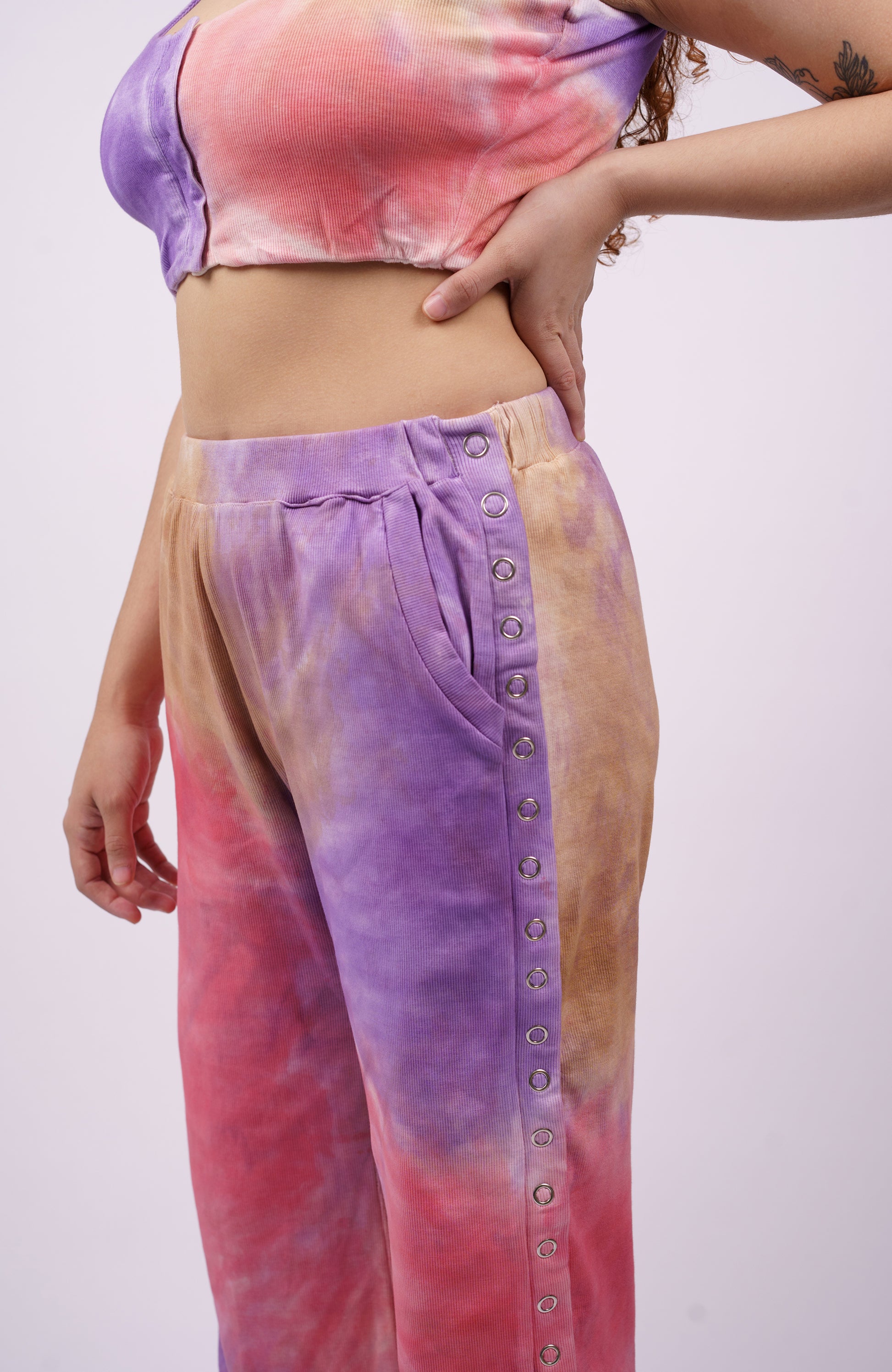 closeup image of women waist wearing elastic special needs outfit with pants and top